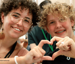 Young people shaping heart with their hands